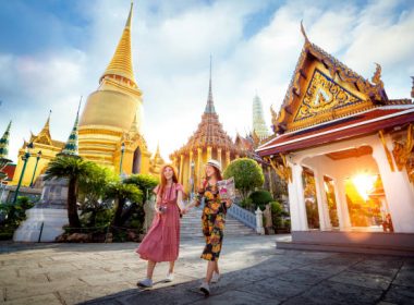 Asian girl walk in Wat phra kaew and grand palace travel in Bangkok city, Thailand